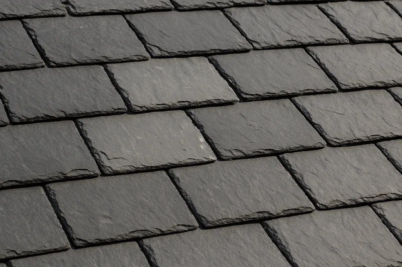 Overlapping grey slates in straight courses, one a shade lighter — slate roofing, Ballarat. Illustrative example.